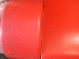 a red couch that is sitting in a room