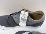 a close up of a pair of shoes with a price tag on them
