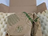 a cardboard box with a piece of food inside of it