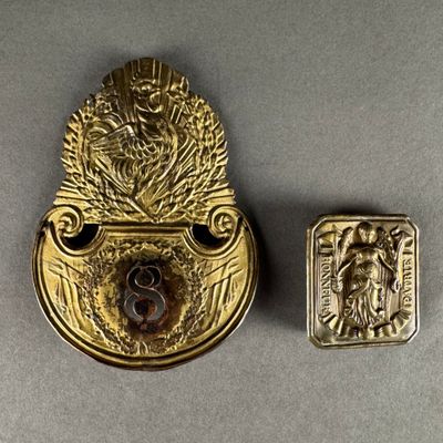 a close up of a metal object on a table next to a button