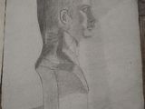 an old drawing of a man ' s head on a piece of paper