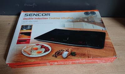 image encadrée représentant une tablette posée sur une table en bois