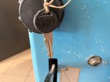 a key that is attached to a blue box