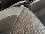 a close up of a car ' s interior with a steering control