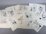 de nombreux dessins représentant des personnes posés sur une table