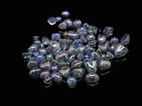blue and silver glass beads on a black background
