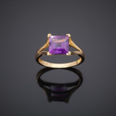 an amethorate and gold ring with a square cut amethorate