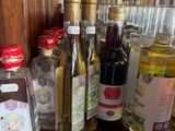 many bottles of alcohol on the counter of a restaurant