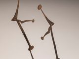 pair of bronze sculptures of a man and a woman holding hands