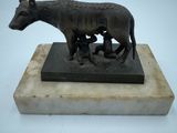 statue of a donkey and a calf on a marble base