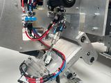 a machine that is sitting on a table with wires attached to it