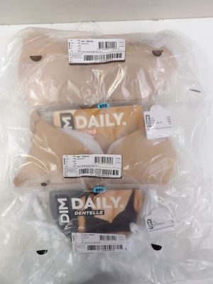 three pairs of socks are wrapped in plastic bags on a table