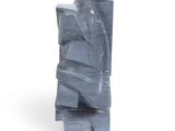 a sculpture made out of blue plastic on a white surface