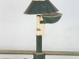 a green lamp that is sitting on a table
