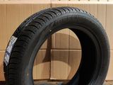 tires are stacked on a cardboard box in front of a cardboard box