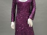 a purple sequinized dress on a mannequin mannequin mannequin mannequin mannequin mannequin mannequin mannequin