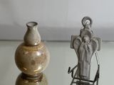 two vases that are sitting on a glass table