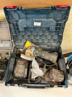 a tool box with tools on a table next to other tools