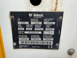 a sign on the side of a machine that says bobcat
