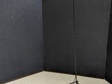 a lamp that is on a tripod in a room