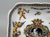 a plate with a picture of a man and a woman on it