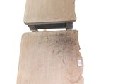 two pieces of wood are stacked on top of each other on a white surface