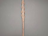an image of a wooden sword on a gray background