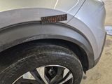 a close up of a car tire with a sticker on it
