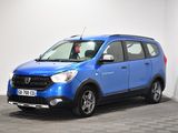 the small blue car is parked in a room with a checkered floor