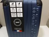 a blue suitcase sitting on a white table