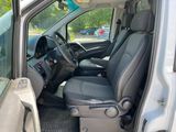 the interior of a white van with the door open