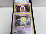 a close up of a box of pokemon cards on a table