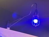 a blue light that is on the ceiling of a room