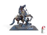 bronze statue of a man on a horse with a horse and a dog