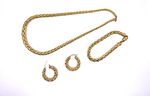 Parure maille palmier en or jaune 750°/°° comprenant un collier, 