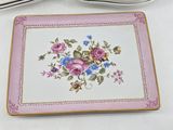 a plate with a floral design on it next to a fork and knife