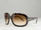 the sunglasses are made of plastic and have brown tinted lenses