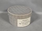an image of a small round box with a label on it