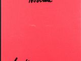 a red book with a black writing on it