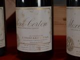three bottles of wine sitting on a table