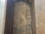 a wooden box that has a window in it