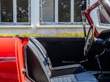 a close up of a red car with the door open