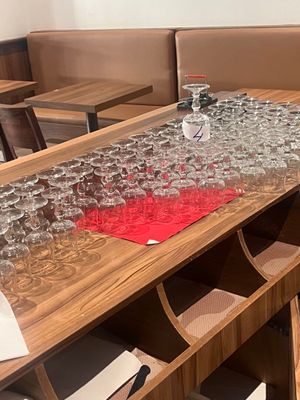 a table that has a lot of wine glasses on it