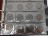 a binder with coins in it on a table