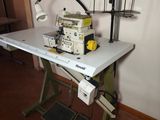 a sewing machine sitting on a table in a room