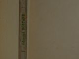 an open book with a ruler sticking out of it ' s side