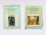 two books on a white surface with a picture of a woman in a black dress