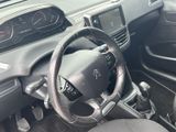 a steering wheel and dashboard of a car in a car showroom