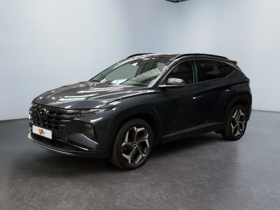 a black suv parked in a room with a white wall
