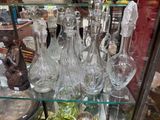 many glass vases on display in a glass case